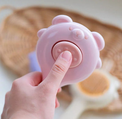 Cepillo para mascotas estilo osito con botón de autolimpieza