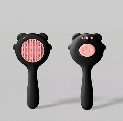 Cepillo para mascotas estilo osito con botón de autolimpieza
