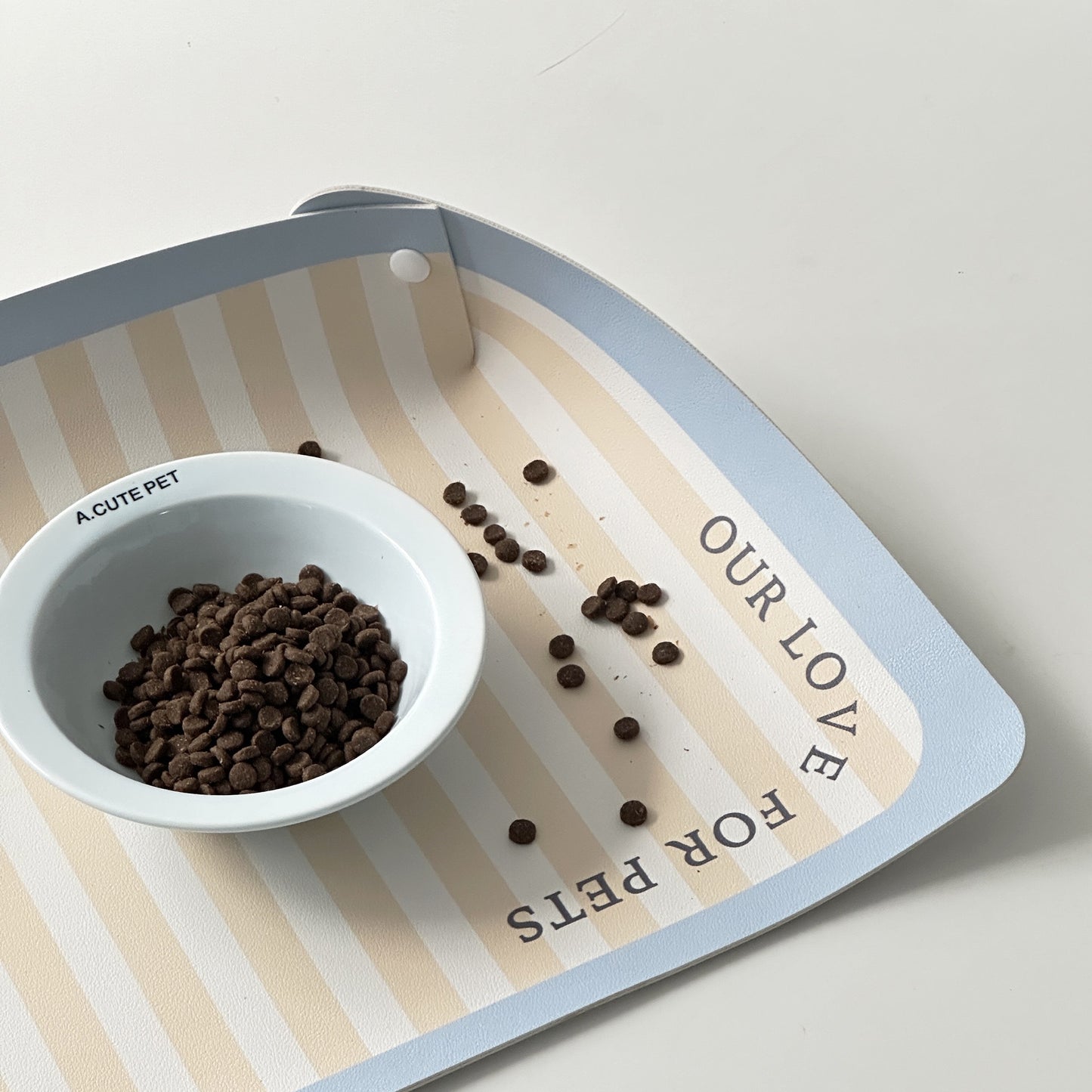 Alfombra de comedero impermeable de rayas